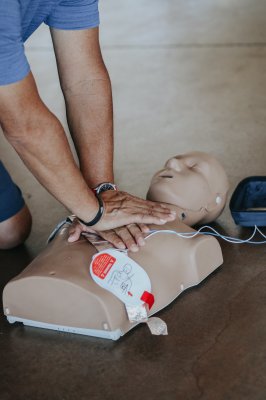 practicing cpr on a tool